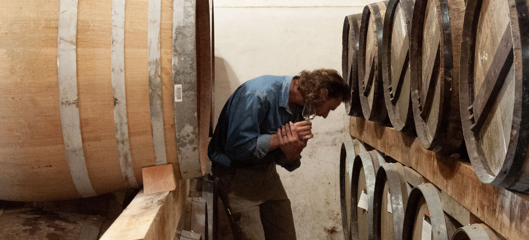 Our Director of Production, Caleb, in our Chai inspecting barrels.